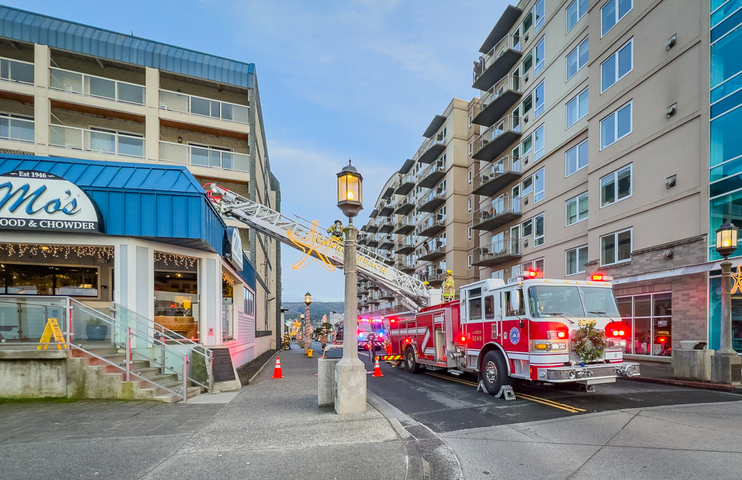 A fire truck is parked in front of a building.
